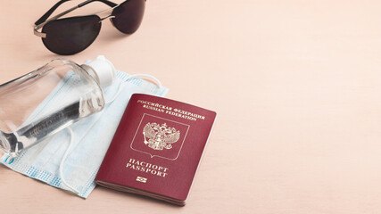 Safe travel during coronavirus pandemic concept. Protective medical mask, sunglasses. sanitizer and...