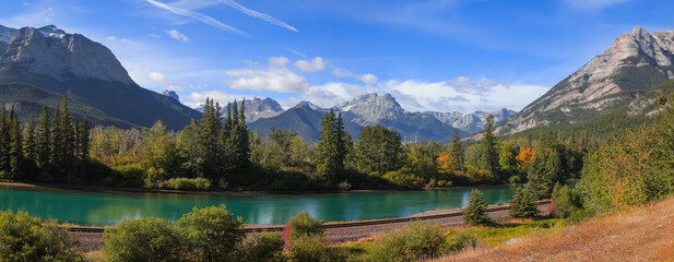 Panoramic view of coniferous trees by the Bow river in Banff national park
