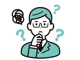 考えごとをする、メガネをかけたビジネスマン