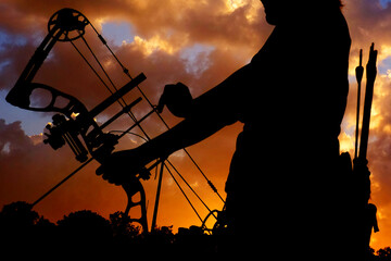 Silhouette of people playing archery