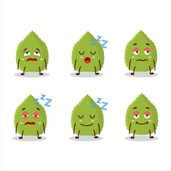 Cartoon character of basil leaves with sleepy expression