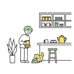 キッチンで犬にごはんをあげる男性