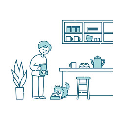 キッチンで犬にごはんをあげる男性