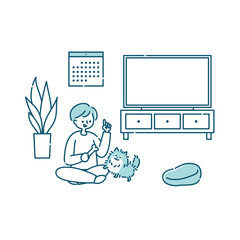 リビングのソファーに座って犬と一緒にくつろぐ女性