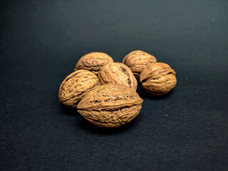 walnuts on black background