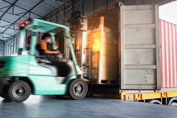 Forklift Tractor Loading Cargo Boxes at Dock Warehouse. Shipment. Packaging Boxes Supply Chain. Distribution Warehouse Shipping. Lorry. Cargo Freight Truck Transport Logistics. © Siwakorn1933