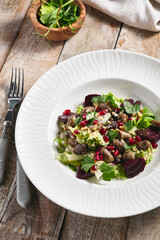 Warm Chicken Liver and Beet Salad. Restaurant food plate on wooden table. Vegetables, healthy, organic food concept