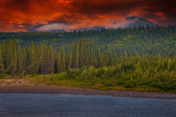 Picturesque Mountains of Alaska in summer. Snow covered massifs, glaciers and rocky peaks. Beautiful natural background.