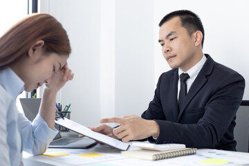 Warning offenders, supervisor in a black suit warns or scolds a woman finance worker for the wrong operation, Punishment for malfunctions or failures.