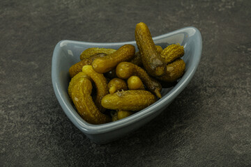 Pickled gherkin in the bowl
