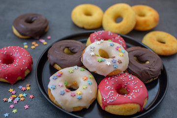 Donuts pattern. Top view of assorted glazed donuts