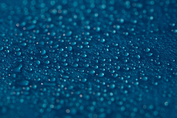 Drops texture. Wet water bubble pattern on blue glass background.