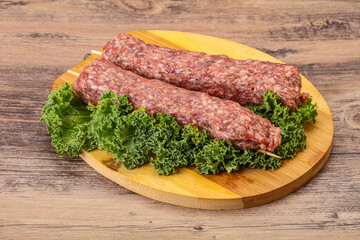 Raw minced beef kebab skewer