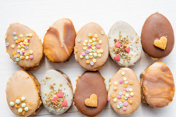 homemade easter spring chocolate egg cookies decorated with sprinkels 