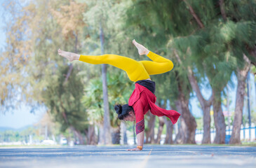 Sport woman wear India sport wear style posing practice yoga on beach  ,yoga is healthy sport balance meditation body concept.