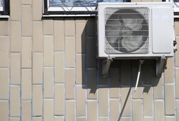 outdoor air conditioner on the building wall