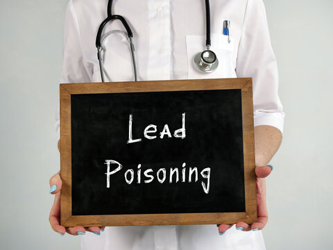 Healthcare concept meaning Lead Poisoning with sign on the sheet.