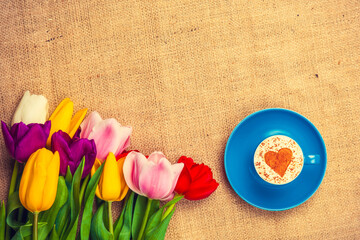 tulips and cup of cuppuccino