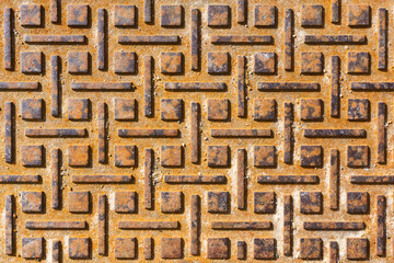 Rusty metal sheet background. Manhole cover texture. Heavy iron plate pattern. Anti slippery metal surface. Grunge corroded metal texture.
