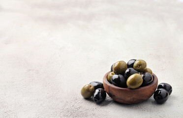 Fresh black olives and green olives fruits  on concrete backgrounds.