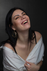 Studio portrait of a brunette in white T-shirt