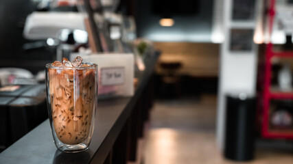 glass of iced coffee with milk on the table