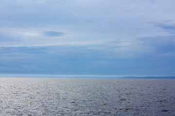 Obraz premium Blue sea or ocean water surface, underwater with sunny and cloudy sky