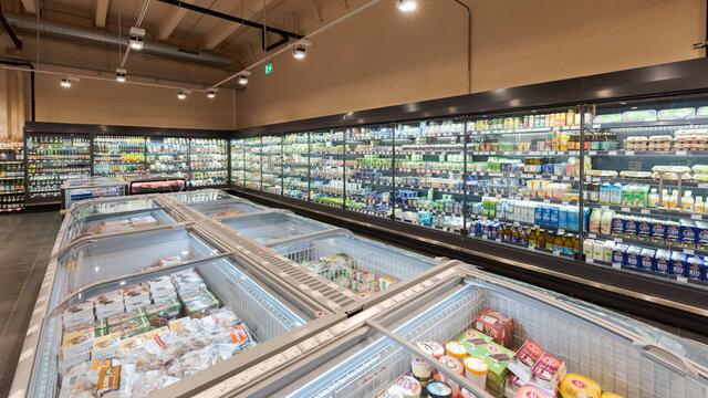 Munich, Germany - 2021 11 05: Overview of fridge section and freezing compartment in german organic supermarket