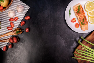 Cooking salmon steak with salad. Homemade fresh fish for healthy and diet food.