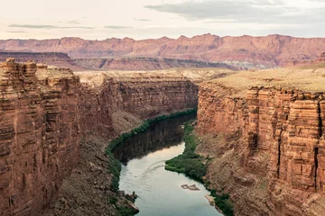 Poster Grand river in deep sandstone canyon walls with desert mountains in Colorado nature in america © AllThings