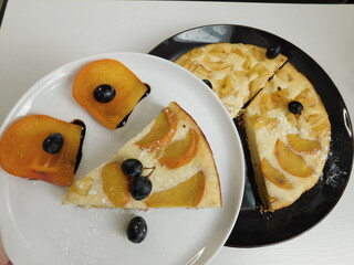 apple pie on a white and black checkered plate on white
