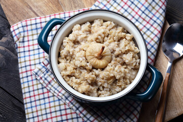 Homemade rustic oatmeal with sun dried figs