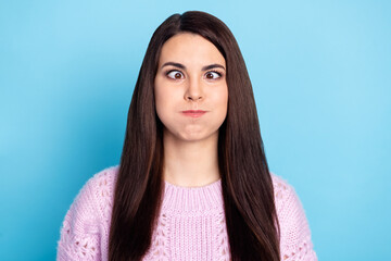 Photo of young woman childish fooling grimace hold breath funny funky isolated over blue color...