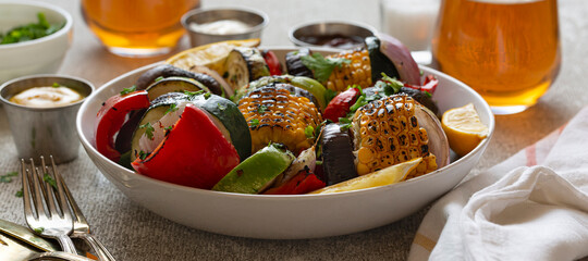 Vegan BBQ with beer outdoors.