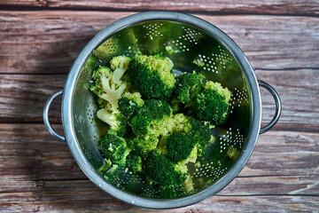 draining bowl full of broccoli for a healthy meal
