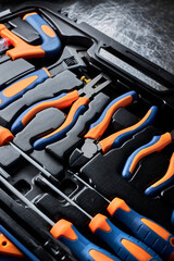 Top view on Suitcase full of various tools, handbox in workshop. copy space, close-up photo of instruments