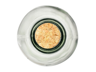 Glass bottle closed with a natural cork stopper. Isolated on a white background, top view.