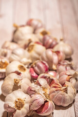 Fototapeta na wymiar white garlic on wooden table