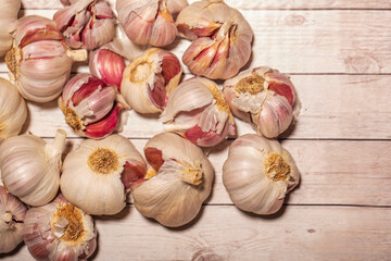 white garlic on wooden table