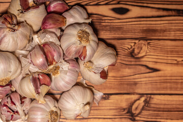 white garlic on wooden table