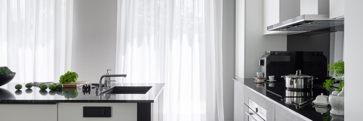 Modern kitchen with kitchen island, panorama