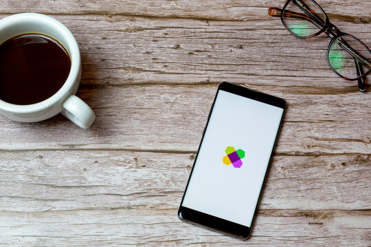02-04-2021 Portsmouth, Hampshire, UK A Mobile phone or cell phone laid on a table or desk with the Wayfair app open and a coffee next to it