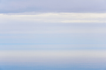Obraz na płótnie Canvas natural background, morning seascape in the gentle dawn mist