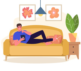 The man is lying on the couch with a tablet in her hands, work online, training online. Relaxing on the couch
