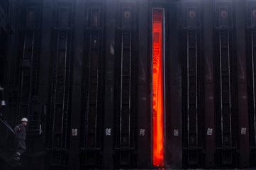 Open door in the oven in the coke oven battery.