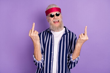 Photo of mature crazy man rude brutal show finger fuck sign careless isolated over violet color...