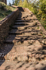 Old brick stairs in the medieval town of San Miniato, in Tuscany, Italy