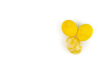 Decorated yellow Easter eggs isolated on a white background