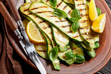 grilled zucchini slices on a clay plate
