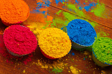 Colorful traditional holi powder in bowls. Happy holi. Concept Indian color festival called Holi. Organic Gulal dust